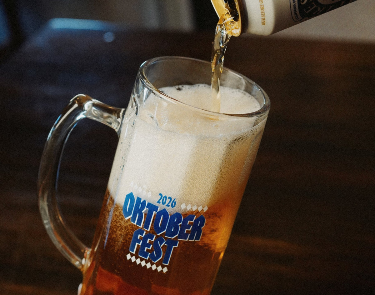 Beer pouring from a Firestone Walker can into the 2026 Oktoberfest tankard.
