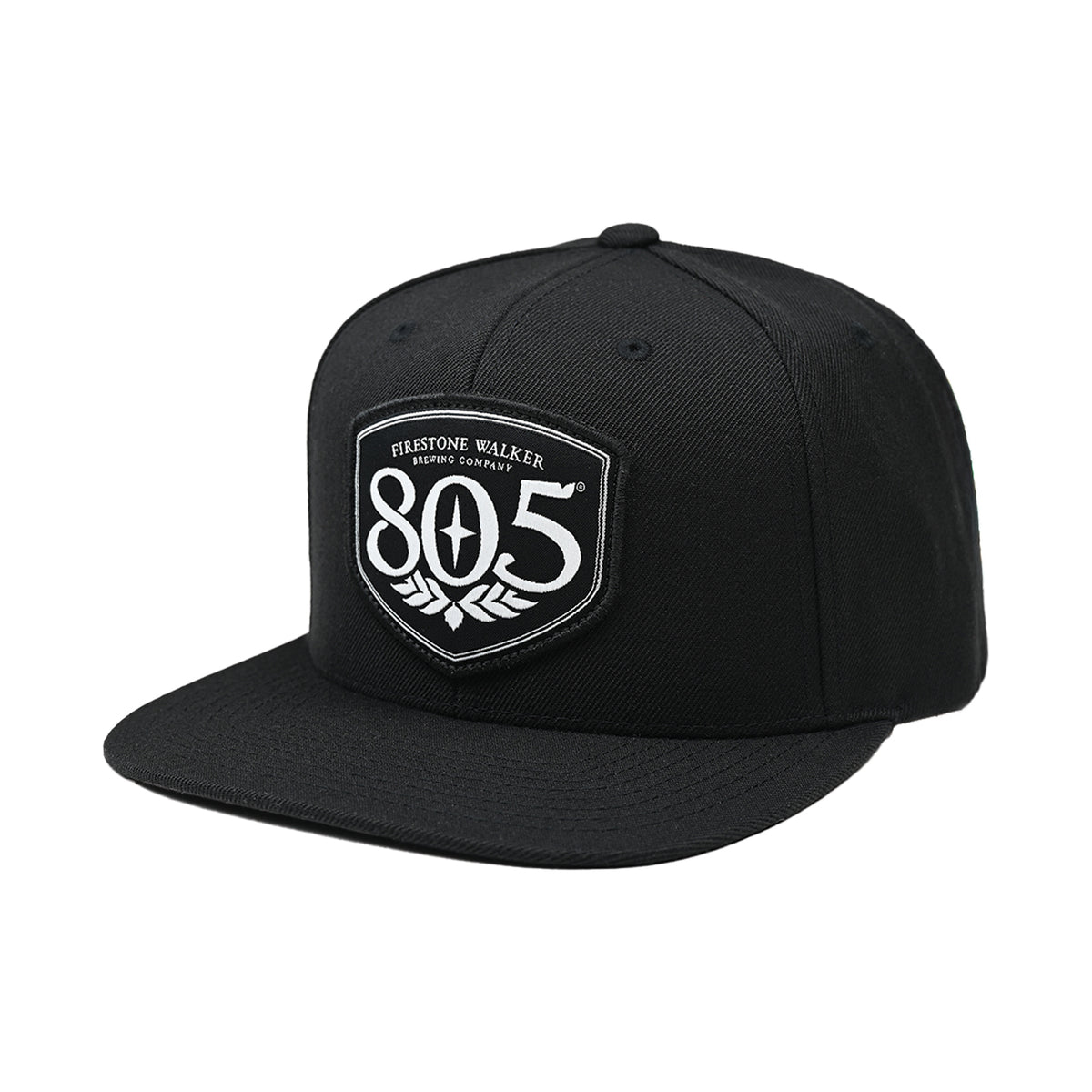 Firestone Walker 805 snapback hat, black with shield logo patch, angled left view