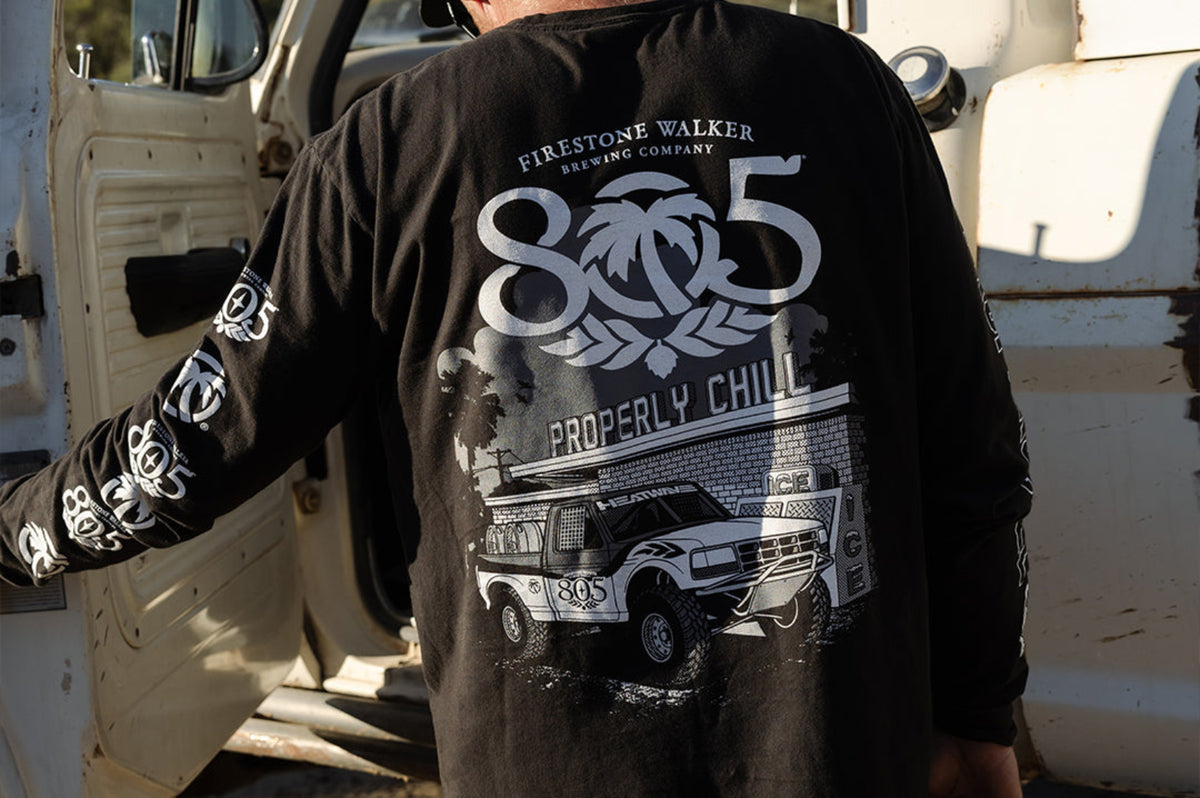 Man wearing 805 x Heat Wave "Properly Chill" long sleeve shirt, back print with off-road truck graphic, black