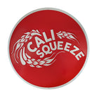 Cali Squeeze round embossed metal tacker sign, red with white citrus swirl design